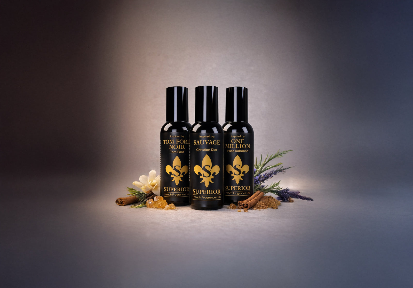 Three Superior fragrance oil bottles styled with botanicals on a dark studio backdrop