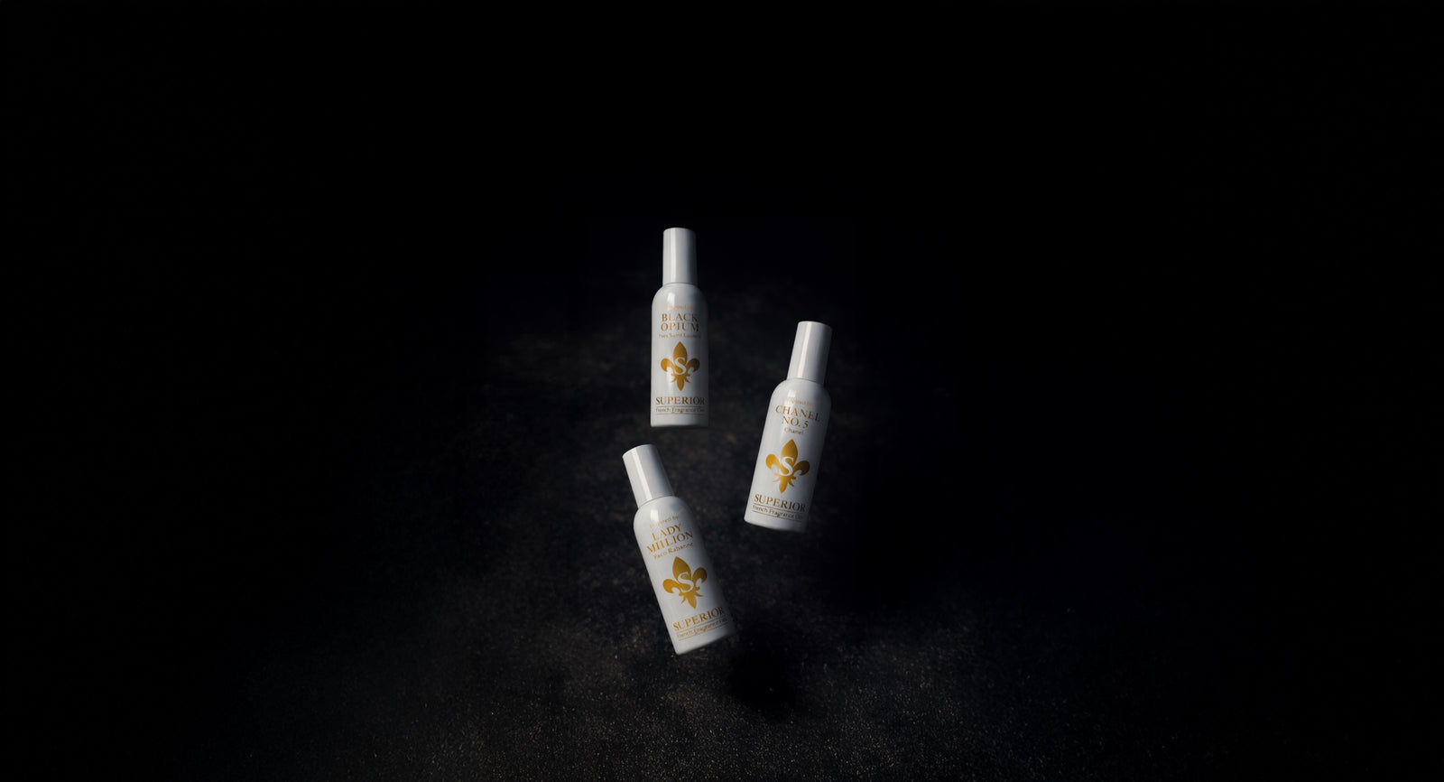 Three Superior fragrance bottles in a spotlight